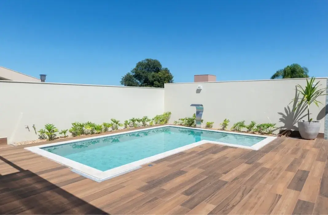 Poolside wooden deck installation with clean modern finish