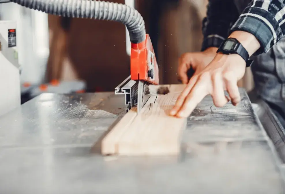 Close-up of wood being cut with precision on a table saw